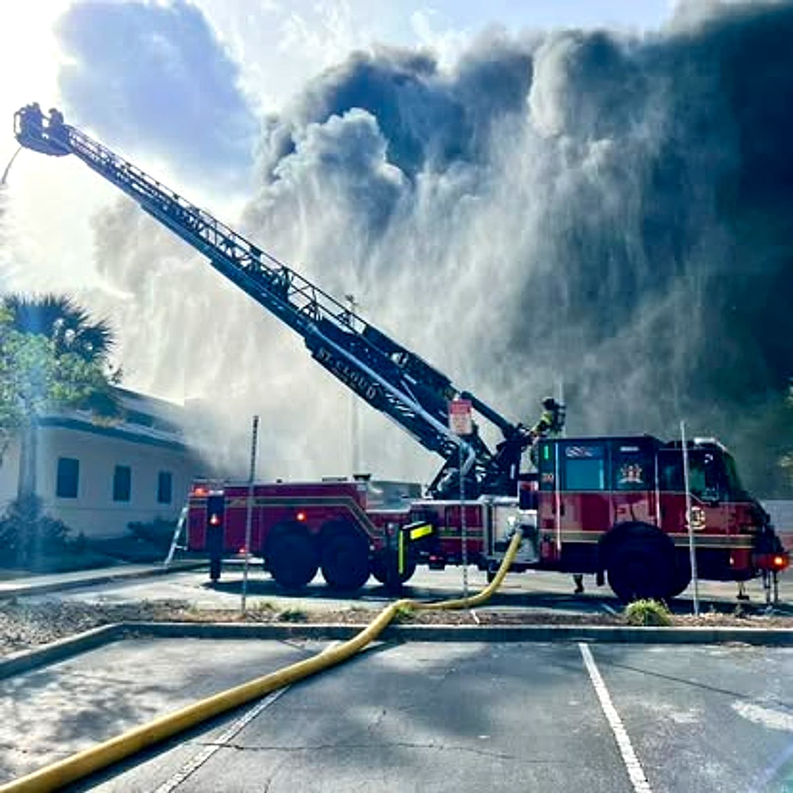 St. Cloud Fire Rescue ladder truck operating at a working fire
